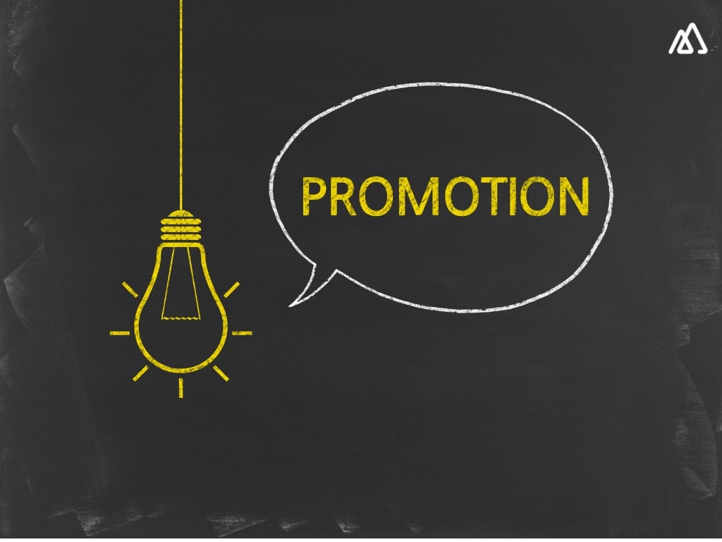 a bulb and promotion written on a blackboard
